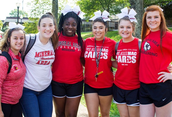 Image shows six female students smiling and posing for a picture in Mineral Area College's outdoor quad