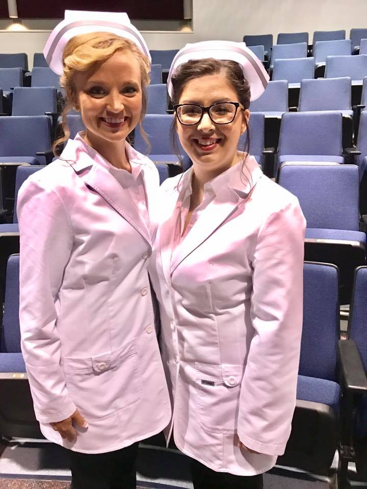 Image shows two female nursing students smiling and posing for a picture just after their graduation from Mineral Area College's Nursing Program