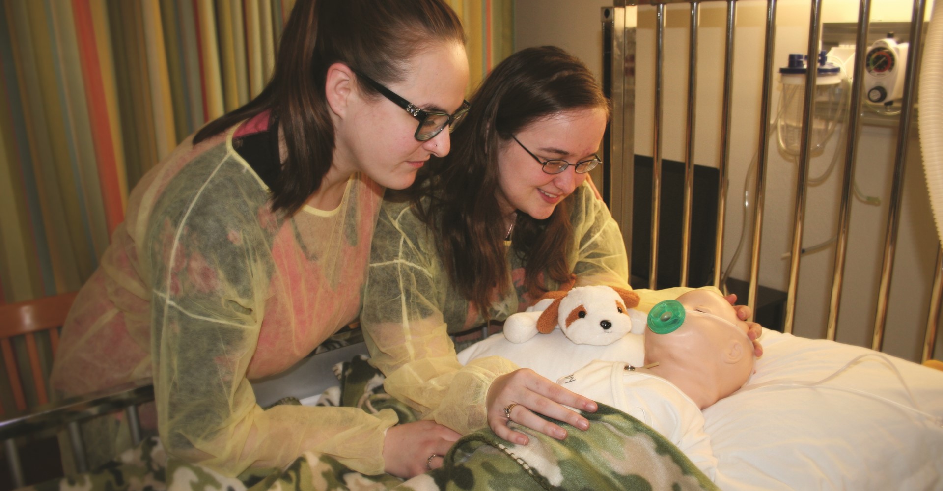 Image shows two female students participating in Mineral Area College's Simulation Lab for the Nursing Program