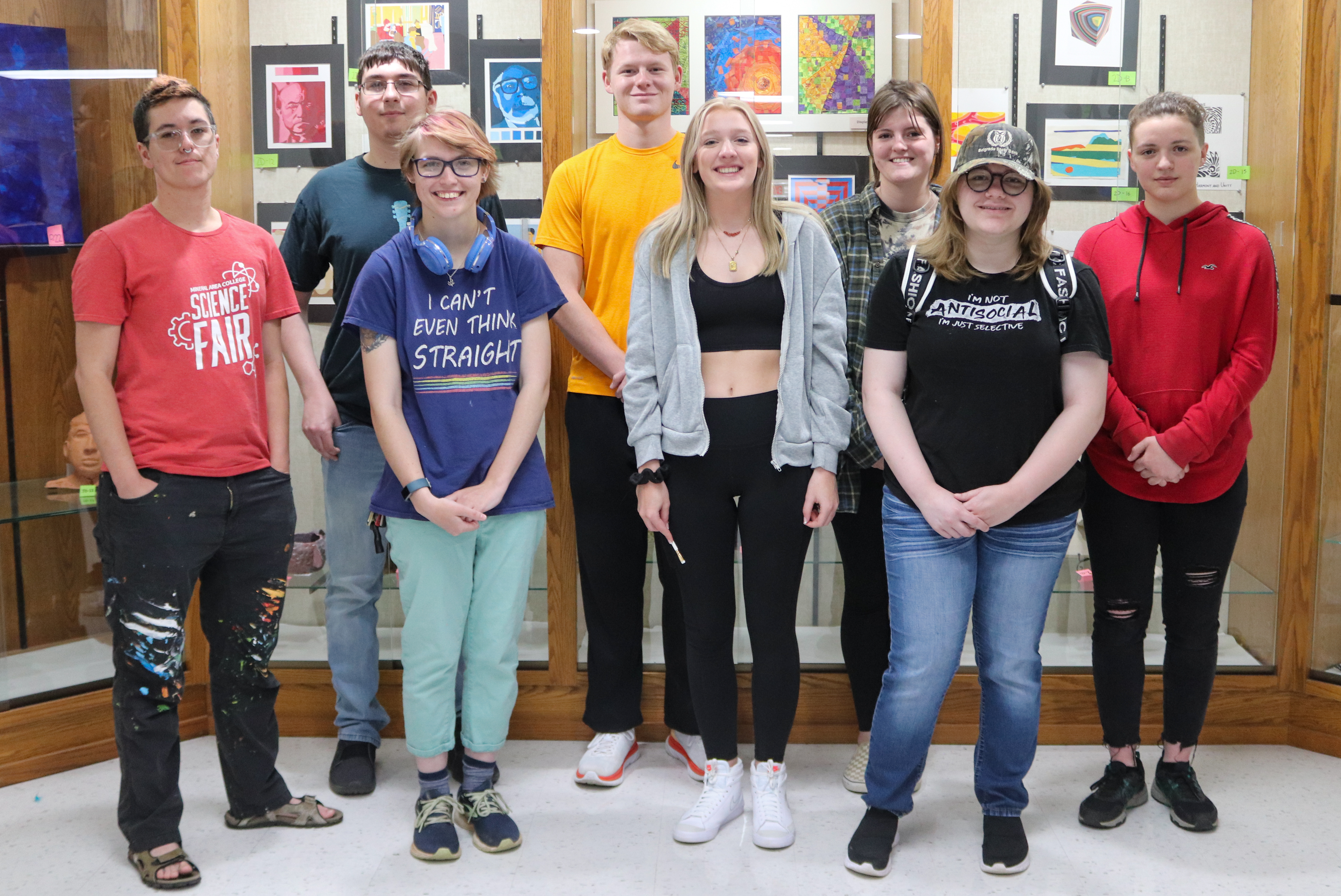 Image of students in front of an art exhibit. 