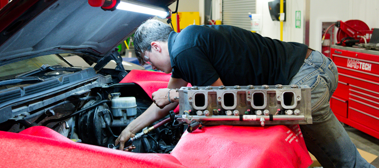 Photo of Auto Tech student working on a vehicle