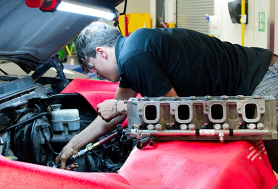 Photo of Auto Tech student working on a vehicle