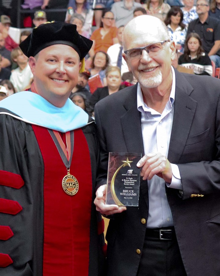 Dr. Gilgour presents the N. Gayle and Rowena Simmons Distinguished Service Award to Bruce Williams at the 2026 Commencement Ceremony